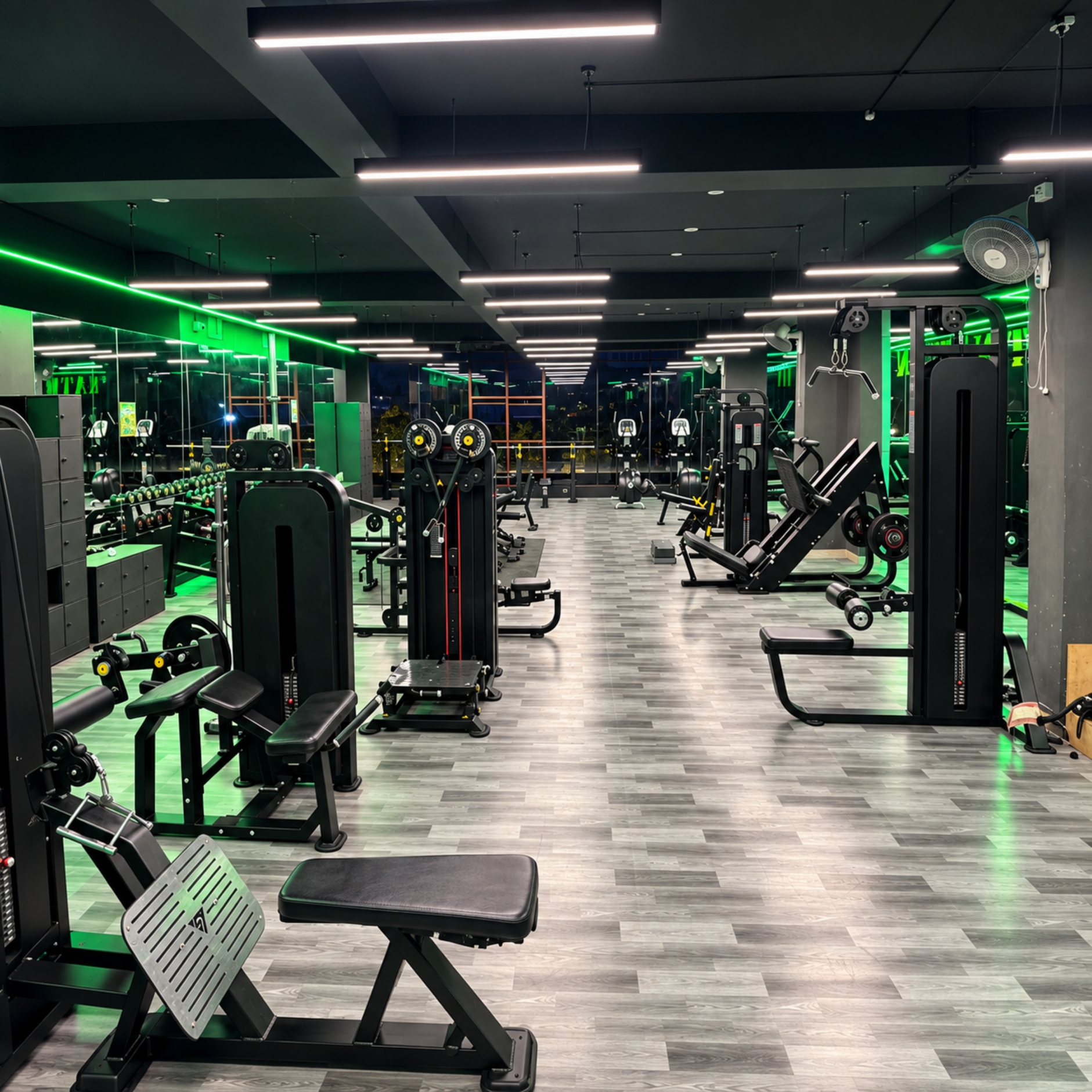 Strength training area with free weights and machines at FIT NATION GYM in Nagasandra, Bengaluru